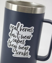 Load image into Gallery viewer, real heroes don't wear capes, they wear scrubs sticker - Be Kind 2 Me